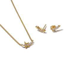 From Pandora, this Shooting Star Pave Jewelry Set in 14k gold-plating will bring a warm glow to your styling. The necklace features a modern, graphic approach to the shooting star motif with a simple silhouette with a row of pave on the tail. A tiny star dangles from the end of the chain, adding an extra touch of stardust to the piece. Matching stud earrings complete the star-studded effect. Wear yours as a trail of holiday magic in your looks, or gift it to your shining star as a symbol of how Shooting Star Necklace, Pave Jewelry, Star Motif, Tiny Star, Shooting Star, Shining Star, Shooting Stars, Star Necklace, Jewelry Set