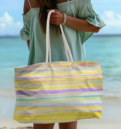 This listing is for a Shoulder Beach Tote with Yellow Stripes in Pastel Coastal colors, a Watercolor look on a Large Shoulder Bag Canvas reusable  beach lover bag sports bag.  A boat lover tote, a travel bag, a beach lover bag, or a  sports bag. Use for a Yoga tote, a reusable grocery eco friendly bag. It's perfect for grocery shopping, beach outings, yoga sessions, water sports on a boat. The reinforced stitched handles provide a comfortable grip, making it easy to carry your belongings. TOTE F Yoga Tote, Watercolor Beach, Overnight Travel Bag, Coastal Colors, Sports Bags Gym, Eco Friendly Bags, Water Sport, Beach Lover, Watercolor Canvas