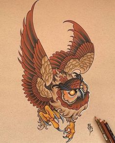 a drawing of an owl with glasses on its head and wings, sitting next to some pencils