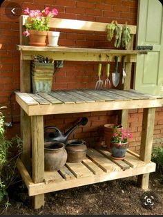 an outdoor potting bench with pots and gardening utensils