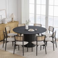 a round table with six chairs around it