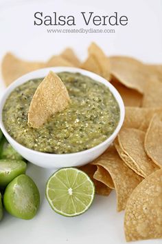 a white bowl filled with guacamole and chips