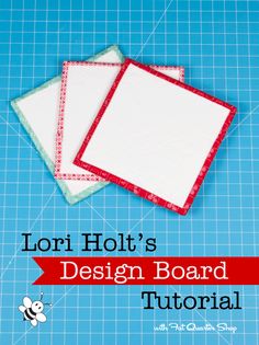 two pieces of fabric sitting on top of a cutting board with the words lori holt's design board