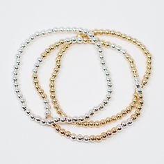 A classic bracelet stack from the beaded lux collection. Stack this dainty stretch bracelet set for a perfect stack for every occasion. Also pairs well with your favorite watch! This style is created with our "stretchy" cords for easy wear and effortless bracelet stacking. Goldfill & Sterling silver beads are approximately 4mm in size. We want to make sure your stretch bracelets have the perfect fit, so we have created sizing options to select above. Please contact us if you have any sizing Elegant Stretch Bracelet With Round Beads, Elegant Stretch Bracelet With Tiny Beads, Minimalist Stackable Stretch Bracelet With Round Beads, Elegant Flexible Stretch Bracelet With Round Beads, Classic Adjustable Stackable Beaded Bracelets, Elegant Gift Bracelet, Elegant Rose Gold Stretch Bracelet For Daily Wear, Elegant Rose Gold Stretch Bracelet For Everyday, Elegant Everyday Rose Gold Stretch Bracelet