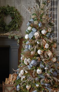 a christmas tree decorated with blue and white ornaments