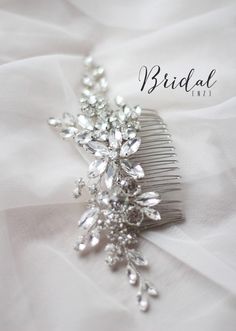 the bridal hair comb is adorned with crystals