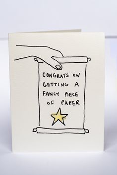 a greeting card with a hand reaching for a star on the front and writing congrats on getting a fancy piece of paper