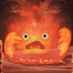 an animated face is shown in the middle of a scene with flames coming out of it