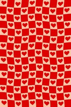 a red and white checkered pattern with hearts on it