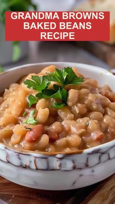 a white bowl filled with baked beans and garnished with parsley