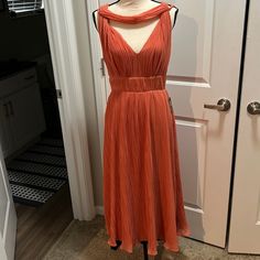 Nwt Beautiful Dress With Grecian Style Elegant Apricot A-line Dress, Apricot Sleeveless Midi Dress For Party, Elegant Apricot Maxi Dress For Party, Elegant Apricot Midi Length Dress, Chic Apricot Party Dress, Spring Orange Pleated Maxi Dress, Pleated Orange Maxi Dress For Spring, Orange Pleated Midi Dress For Spring, Chic Orange Pleated Midi Dress