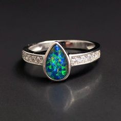 "Natural Australian black Opal triplet Sterling Silver Ring, one-off piece of natural opal set in sterling silver in a modern design.  💎 Main Gemstone: Natural Australian Black Opal 💎 Accent Gemstones: Natural clear Topaz 💎 Material: Solid British Sterling Silver with rhodium plating.  Please note: All my Australian black Opals are one-off pieces so some rings will need to be resized to your size once the order is placed, please allow 4-5 working days for me to change the size for you.  To pr Black Cabochon Opal Ring, Black Opal Ring For Anniversary, Black Fire Opal, Natural Opal Ring, Australian Black Opal, Cosmic Consciousness, Rings Black, Opal Band, Black Fire