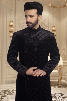 This black sherwani is adorned with delicate cutdana and shimmering sequins, making it an exquisite choice for sangeet ceremonies or reception nights. The perfect choice for any wedding, this sophisticated piece will have you looking and feeling your best. Formal Party Wear Kurta With Zari Work, Party Wear Kurta With Traditional Drape For Reception, Formal Traditional Wear With Traditional Drape For Party, Elegant Bandhgala With Traditional Drape For Party, Black Sherwani For Diwali Party, Black Sherwani For Party And Festivals, Black Party Wear Kurta For Diwali, Traditional Black Sherwani For Party, Black Sherwani With Dabka Work For Party