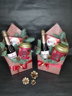 two christmas baskets with wine bottles in them