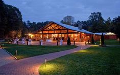 an outdoor wedding venue lit up at night