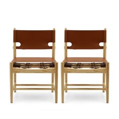 two wooden chairs with brown leather seats on each one and the other side, facing opposite directions