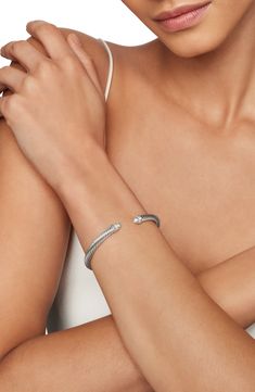 A cable-spiraled texture brings David Yurman's signature aesthetic to this sterling silver cuff bracelet ringed with pavé diamonds at the tips. 1/8" width Total diamond weight: 0.07ct. Sterling silver/diamond Imported >Diamond Guide Artistic Signature, David Yurman Bracelet, Cable Bracelets, Diamond Guide, Women's Bracelets, Sterling Silver Cuff Bracelet, Sterling Silver Cuff, Silver Cuff Bracelet, Recycled Sterling Silver