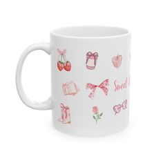 a white coffee mug with pink bows and hearts on the side, says sweet life