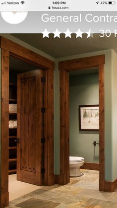 an open door leading to a bathroom with green walls and tile flooring, along with the words general contraption