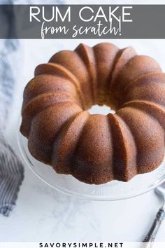 a bundt cake sitting on top of a white plate with the words rum cake from scratch