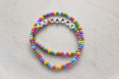 BE HAPPY Beaded Bracelets Smiley Face Custom Personalized - Etsy Fun Multicolor Beaded Bracelets With Letter Beads, Colorful Fun Friendship Bracelets With Letter Beads, Colorful Letter Beads Friendship Bracelets, Fun Rainbow Beaded Bracelets With Letter Beads, Fun Rainbow Friendship Bracelets With Letter Beads, Fun Colorful Beaded Bracelets With Letter Beads, Colorful Fun Beaded Bracelets With Letter Beads, Fun Colorful Beads Friendship Bracelets, Colorful Beaded Friendship Bracelets For Birthday