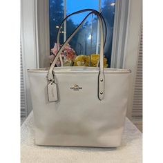 Coach Women's Leather City Zip Tote Coach F58846 Chalk White (Pu180 Brand: Coach Coach Signature City Zip Tote Shoulder Bag Chalk White With Brown Interior Brand New With Tags! Crossgrain Leather Inside Has Large Zip Pocket & Multifunction Pockets Approx 11 1/2" W (Bottom) 15 1/2" W (Top) 10 1/2" H X 5 1/2" D Gold-Tone Hardware Style # F58846 Bag Is In Great Condition, No Visible Marks Or Scratches On Leather. Interior Shows No Stains Or Odor, We Only Accept Pay Pal. Payment Are Expected Within Coach White Large Capacity Shoulder Bag, Cream Shopping Bag With Branded Hardware, Everyday Cream Bag With Branded Hardware, Everyday Cream Bags With Branded Hardware, Brown Interior, Chalk White, Zip Tote, Leather Interior, Brown Gold