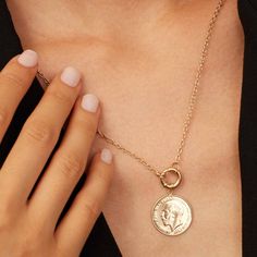 Our Majesty Coin Necklace features the distinguished profile of King George, a symbol of regal heritage and history. Crafted with precision, the Majesty Coin Necklace is perfect for those who appreciate historical significance combined with contemporary style. Wear it solo for a minimalist look or layer it with other pieces for a chic statement. Elegant Gold-plated Medallion Jewelry, Elegant 14k Gold Medallion Jewelry, Elegant Coin Pendant Jewelry As Gift, Gold Plated Coin Pendant Jewelry, Elegant Rose Gold Medallion Jewelry, Elegant Tarnish-resistant Medallion Necklace, Elegant Silver Coin Necklace For Anniversary, Elegant Gold Coin Necklace, Elegant Coin Necklace With Clavicle Chain