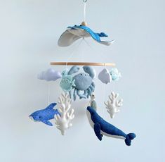 a mobile with sea animals hanging from it's sides