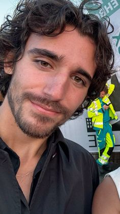 a close up of a person wearing a black shirt