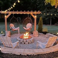 a fire pit surrounded by chairs and lights