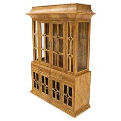 a wooden cabinet with glass doors on the front and side panels inlayed to it's sides