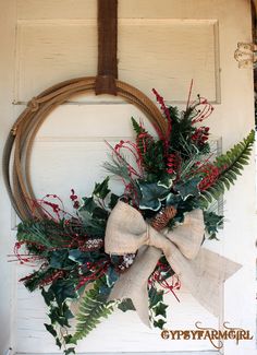 a christmas wreath hanging on the front door