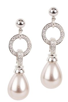 How to make a pearl earring even better? Add crystals. We combined two of our favorite things to create an updated pearl earring that is classy and effortless to wear. You'll never want to take our Crystal Hoop Pearl Dangle Earrings off. Size: 2" long Materials: Shell Pearl, Rhodium, Zircon Post Back Classic Metal Earrings With Pearl Charm, Elegant Pearl White Metal Pearl Earrings, Elegant Metal Pearl Drop Earrings, Elegant Metal Earrings With Pearl Pendant, Pearl Pendant Drop Earrings In Metal, Elegant Metal Pearl Drop Bridal Earrings, Elegant Dangle Pearl Drop Hoop Earrings, Elegant Pearl Drop Dangle Hoop Earrings, Elegant Sterling Silver Pearl Drop Crystal Earrings