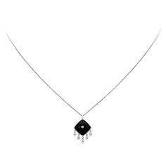 A stylish drop necklace, showcasing a 3.60 carats cushion cut black onyx with a 0.02 carat round brilliant cut diamond on the center. Accented by five hanging briolette diamonds weighing 0.68 carat total. Finely made with 18K white gold.  Available in matching earrings. Please inquire about item DEAR1595.  Roman Malakov is a custom house, specializing in creating anything you can imagine. If you would like to receive a special quote on a custom piece, please message or call us. Custom House, Drop Necklace, Round Brilliant Cut Diamond, Cushion Cut, Brilliant Cut Diamond, Diamond Pendant, Matching Earrings, Black Onyx, Round Brilliant