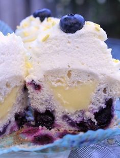 a blueberry cheesecake is cut in half on a plate