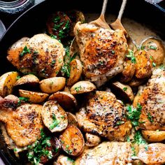 chicken and potatoes in a skillet with parsley on the side, ready to be eaten