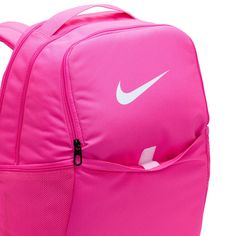 Grab your gear and get going with the Nike Brasilia Backpack. It has plenty of pockets to help you stay organized, including a sleeve to fit your laptop, side mesh pockets for water bottles, and a zippered pocket on the inside to keep small items secure. This product is made with at least 50% recycled polyester fibers. Haul loop at the top. Spacious main compartment. Padded, adjustable shoulder straps. Front zip pocket. Internal laptop sleeve. Dimensions: 18" H x 12" W x 7" D. Capacity: 24 L. Sh Pink Nylon Bags For Outdoor, Pink Nylon Outdoor Bag, Pink School Bag With Water Bottle Pocket, Casual Pink Bags With Functional Pockets, Sporty Pink Bag For Outdoor, Pink Backpack With Water Bottle Pocket For Daily Use, Pink School Backpack With Water Bottle Pocket, Sports Backpack With Functional Pockets, Pink Bags For Outdoor And Back To School