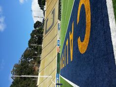 an empty football field with the number 3 painted on it