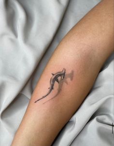 a person with a tattoo on their arm