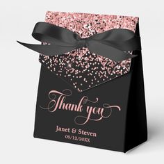 a black and pink thank you bag with glitters on it, tied in a bow