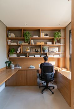 a person sitting at a desk in an office