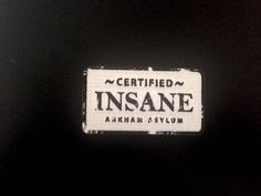 a black and white label that says certified insane