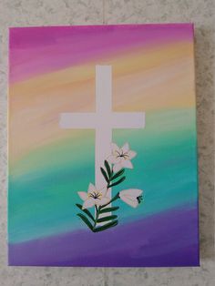 a painting of a cross with flowers on it