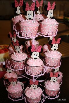 there are many cupcakes with minnie mouse decorations on them