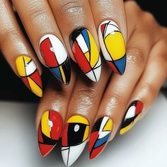 a woman's hands with colorful nail art on their nails and manicures