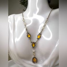 Brand New And Never Worn 90s Amber Stoned Sterling Silver Statement Necklace And Matching Amber Earrings 17” Adjustable Length Amber Necklace In Perfect Condition 2” Amber Stone Dangle Drop Earrings Functioning Clasp Picture To Ensure Working Closure No Missing Stones Or Defects Items Can Be Switched Upon Request With Other Items In Closet Fast And Free Shipping Offered Please Comment For Additional Photos/Videos For An Enhanced Look 90s Necklace Vintage, 90s Jewelry Necklaces, Yellow Crystal Necklace For Party, Yellow Metal Party Jewelry, Yellow Jeweled Jewelry For Party, Yellow Costume Jewelry For Parties, Vintage Yellow Dangle Earrings, Vintage Yellow Dangle Jewelry, Vintage Yellow Jewelry For Gifts