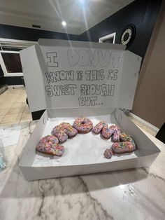 there are donuts in the box on the counter