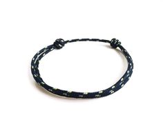 Nautical halyard cord or also called lanyard cord bracelet. - NAVY speckled white and yellow. Lucky bracelet to slip while making a wish. o Cord Thickness (diameter): 0.1 in (2 millimeters). o SIZE suitable for everyone thanks to its sliding knots (its circumference is approximately 4.7 inches (12 centimeters) when it is tightened to the maximum and 9 inches (23 centimeters) when it is fully open)! Do not hesitate to contact me if you think you need a specific size (for a baby, a child, a teenag Adjustable Blue Nautical Bracelets, Adjustable Blue Nautical Bracelet, Navy Nautical Adjustable Bracelets, Adjustable Navy Nautical Bracelet, Navy Adjustable Nautical Bracelet, Navy Adjustable Casual Bracelets, Adjustable Blue Braided Bracelets For Outdoor, Adjustable Blue Bracelets For Outdoor, Adjustable Blue Nautical Jewelry