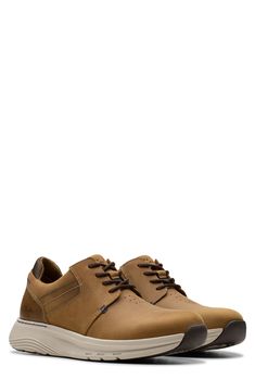 A padded collar adds comfort to this sporty leather sneaker resting on a cushy contoured footbed and lightweight traction sole. Leather upper and lining/synthetic sole Imported Dark Tan, Leather Sneakers, Tan Leather, Nordstrom Rack, Leather Upper, Motion, Nordstrom, Collar, Sneakers