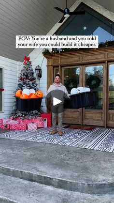 a man standing in front of a house with christmas presents on the porch and outside